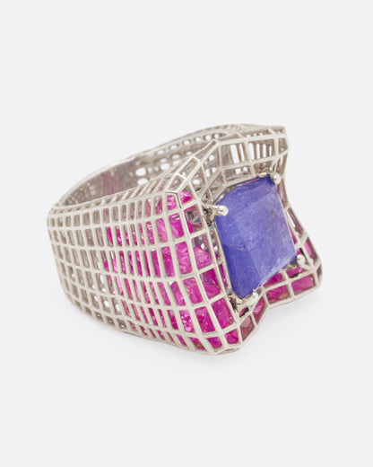 Sterling silver and blue quartz cage ring, side view with the blue quartz facing right