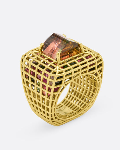 Green gold and bicolor tourmaline cage ring, profile view showing the height of the dome