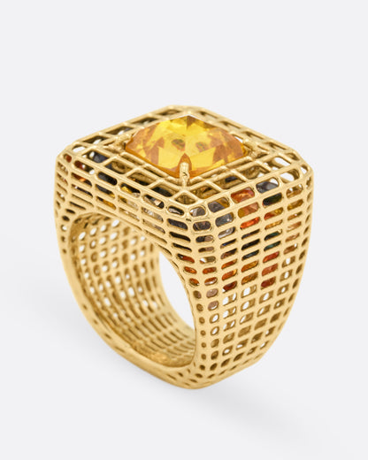 Yellow gold and yellow sapphire cage ring, profile view showing the height of the dome and the openwork band