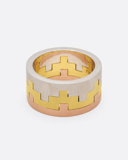 White, yellow and rose gold stacking rings, stacked bands from another side showing how the notches lock together