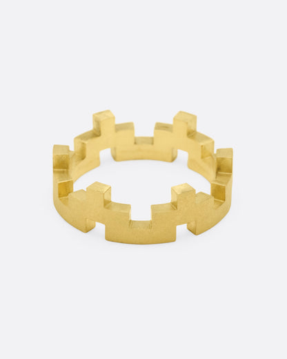 White, yellow and rose gold stacking rings, single yellow gold band with notches on both edges