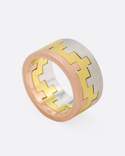 White, yellow and rose gold stacking rings, angled view of the stack showing the inside of the bands