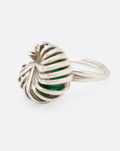 Sterling silver swirl cage ring with peridot, side view from the other direction showing the twisted wires