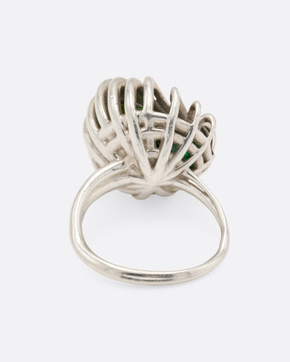 Sterling silver swirl cage ring with peridot, back view of the band below the cage