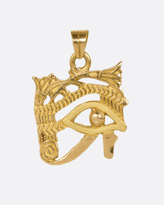 A yellow gold Eye of Horus pendant shown from the front.