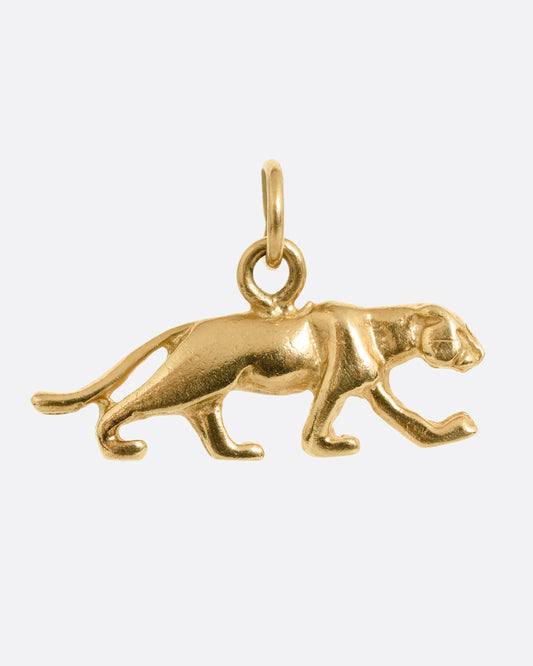 A yellow gold panther charm shown from the front.