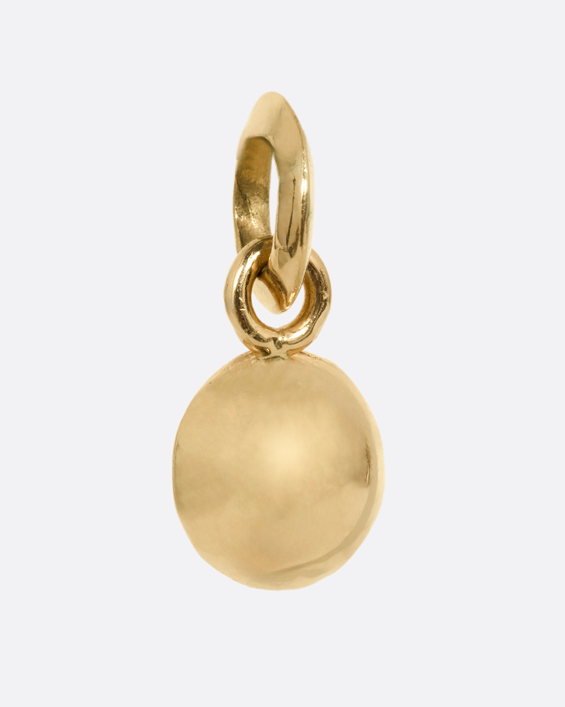 A round yellow gold pendant with an Old European cut diamond. Shown from the back.
