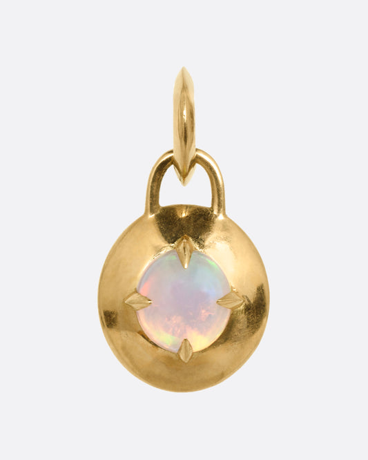 A round yellow gold pendant with a prong set opal, shown from the front.