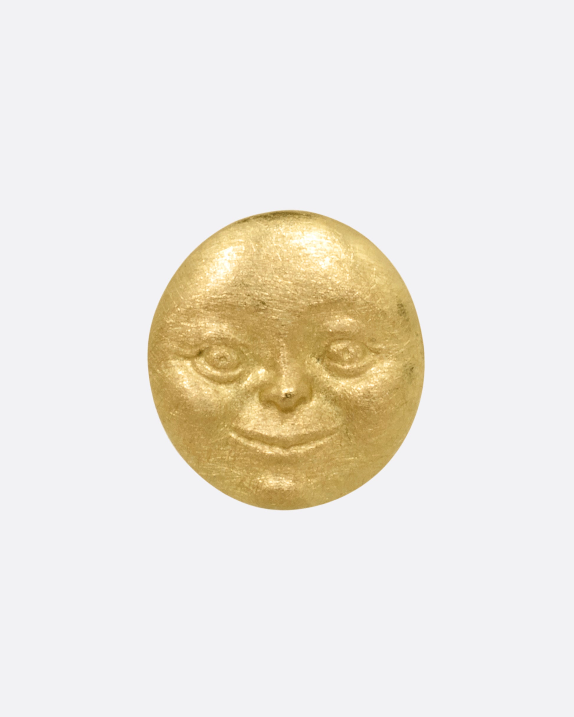A yellow gold moon face stud earring. Shown from the front.