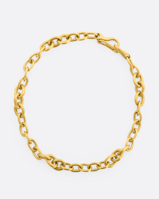 A yellow gold circle link bracelet. Shown closed, from above.