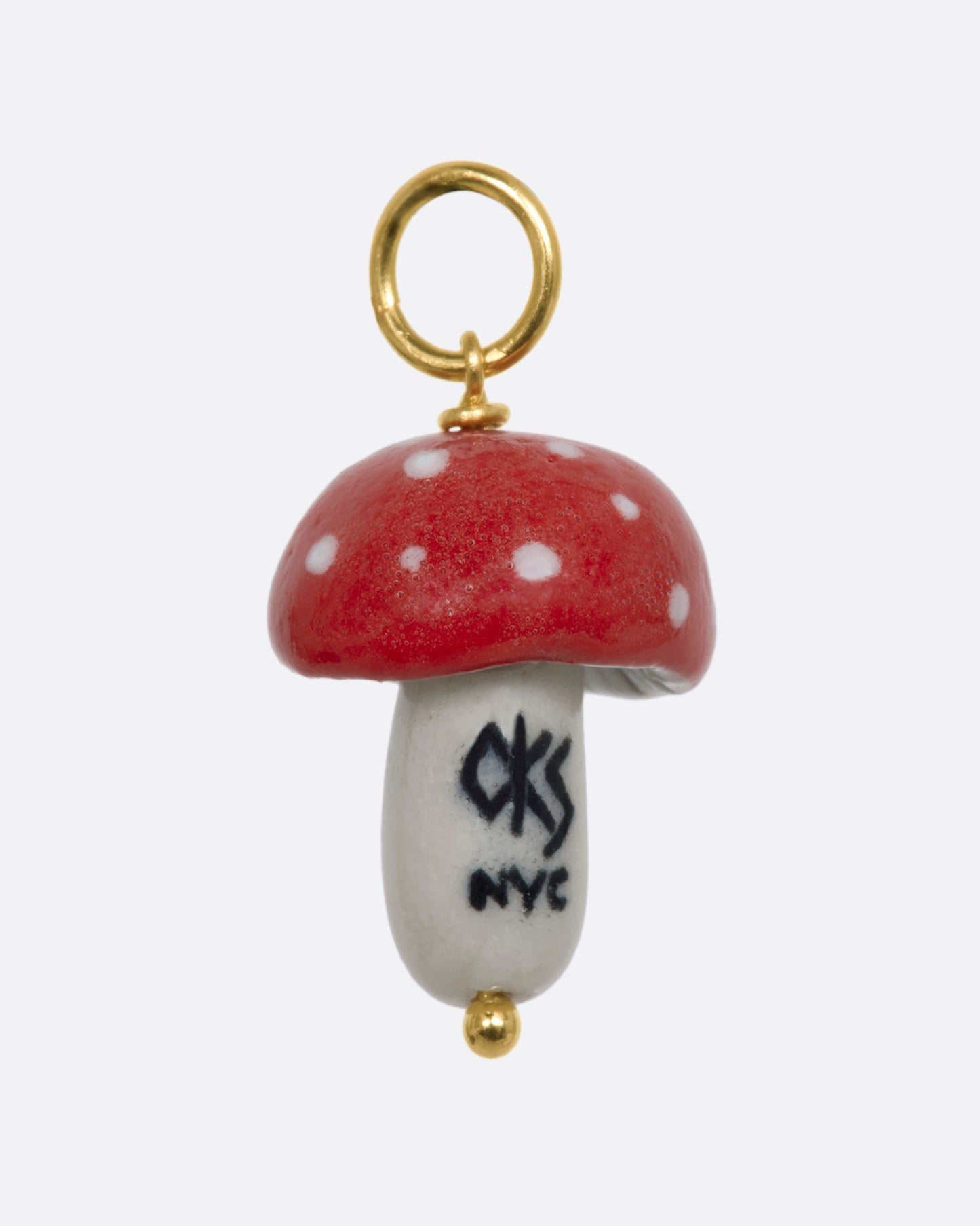 Red mushroom charm on a yellow gold bail. View from the back.