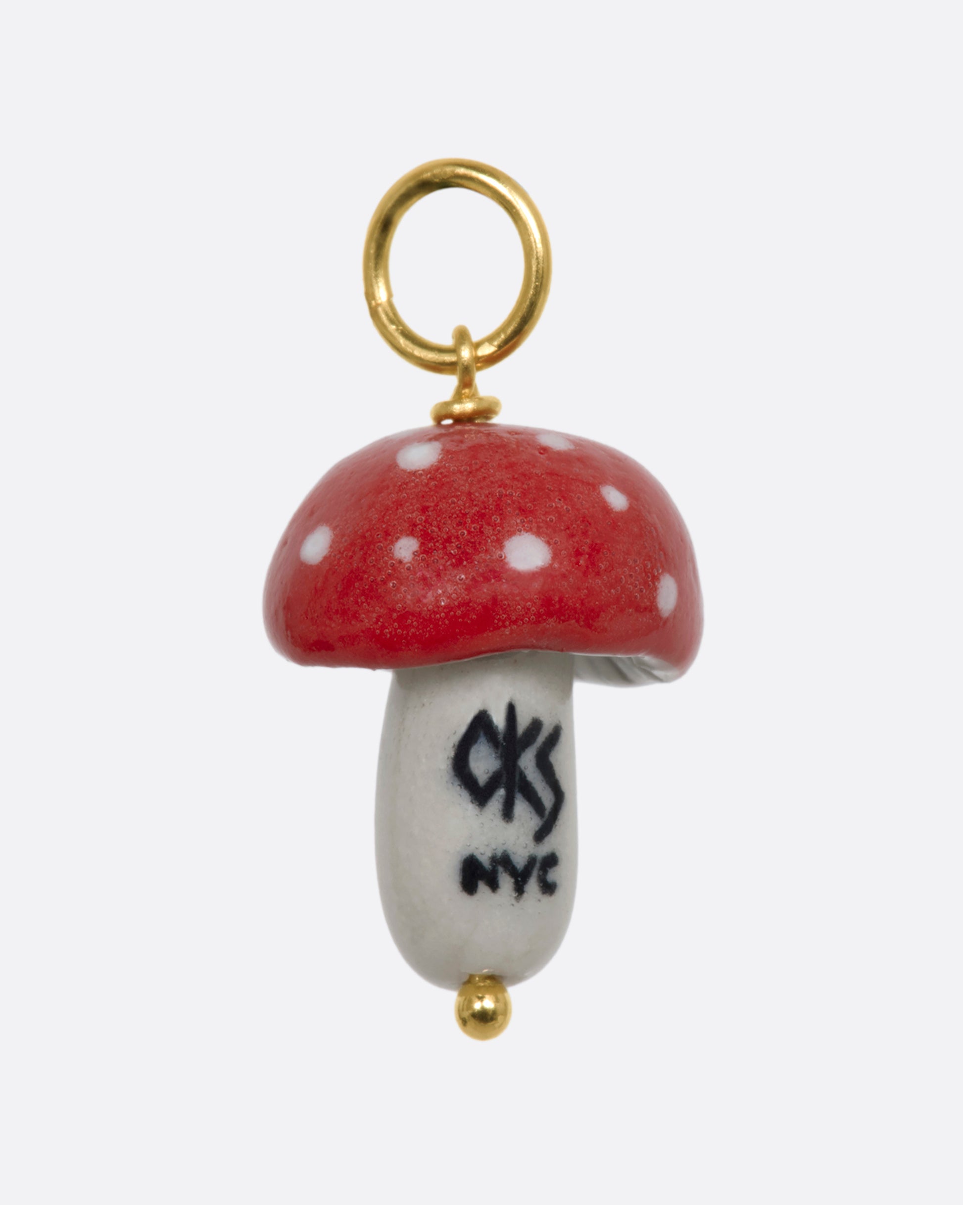 Red mushroom charm on a yellow gold bail. View from the back.