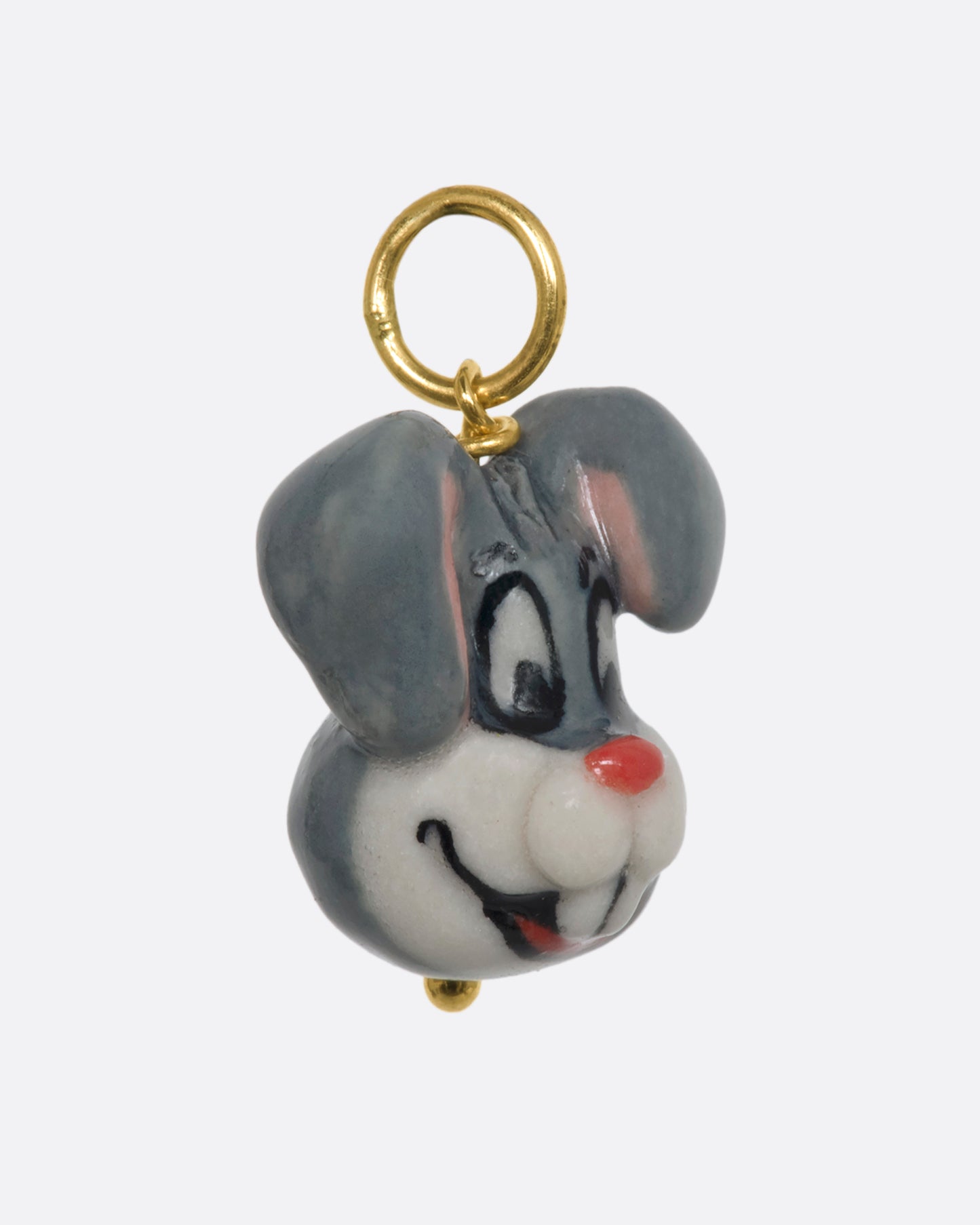 A grey three dimensional bugs bunny charm with a yellow gold bail. View from the side.