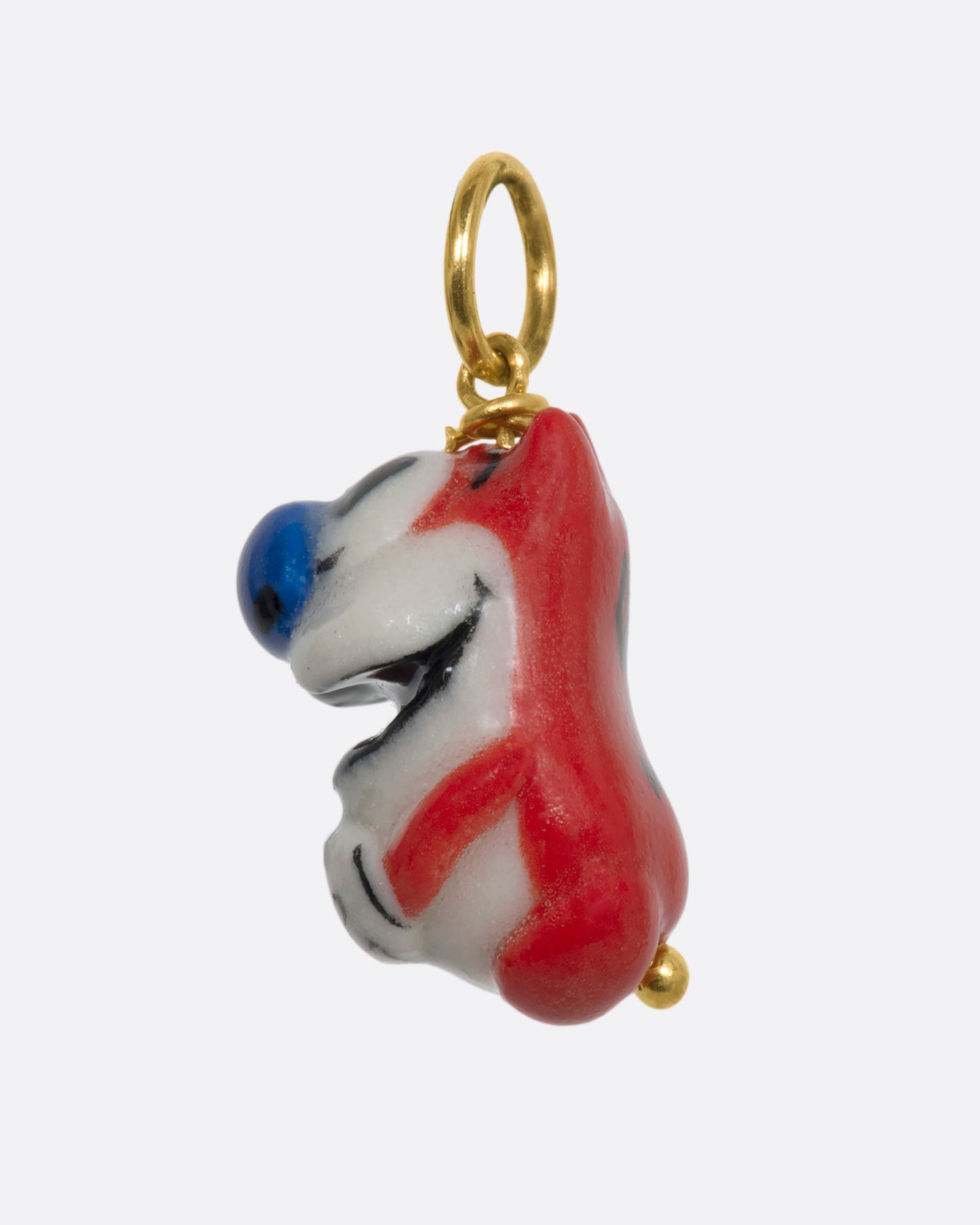 A three dimensional Stimpy charm with a yellow gold bail. View from the side.