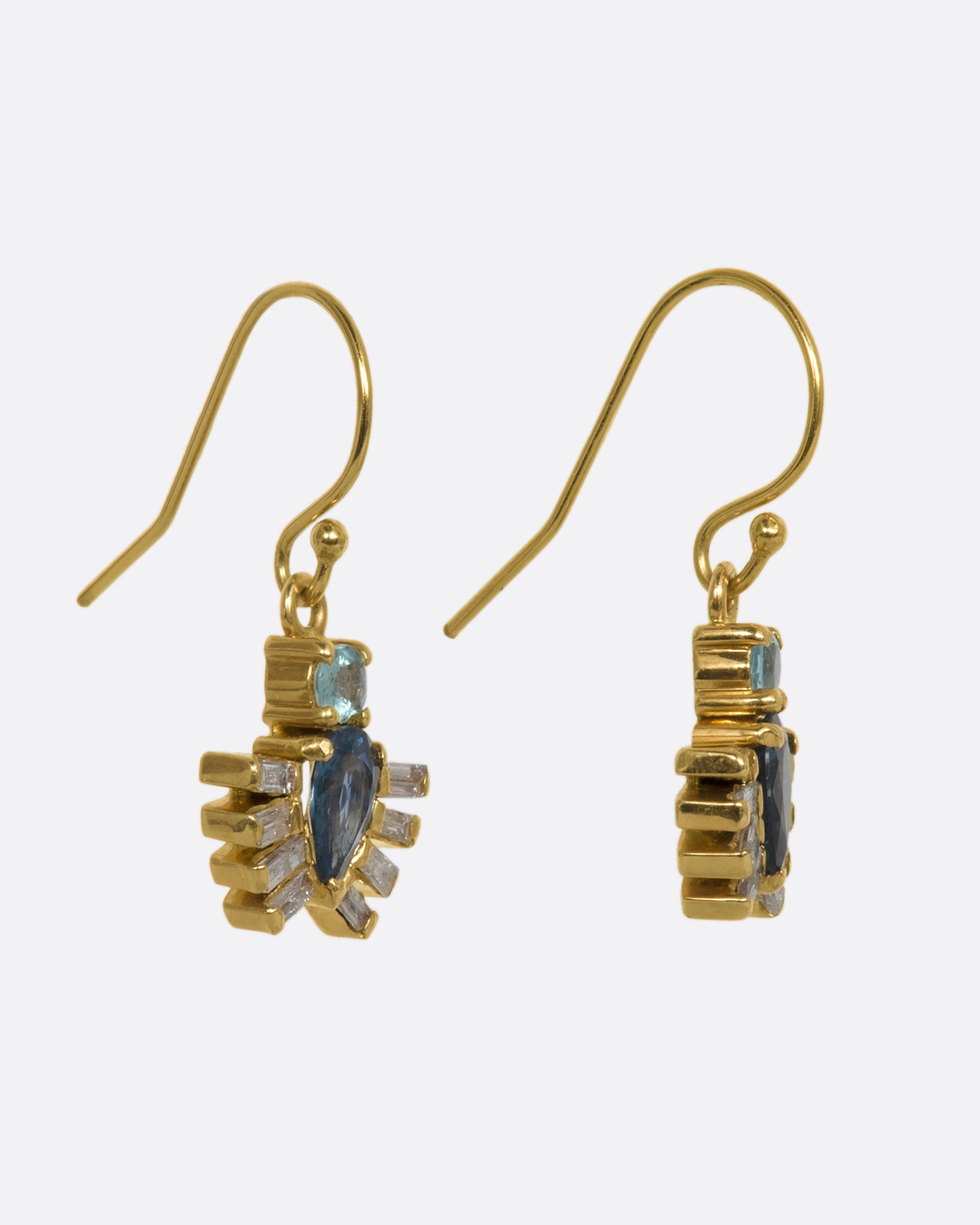 Yellow gold drop earrings with royal beetle dangles made of apatite, sapphires and diamonds. View from the side.