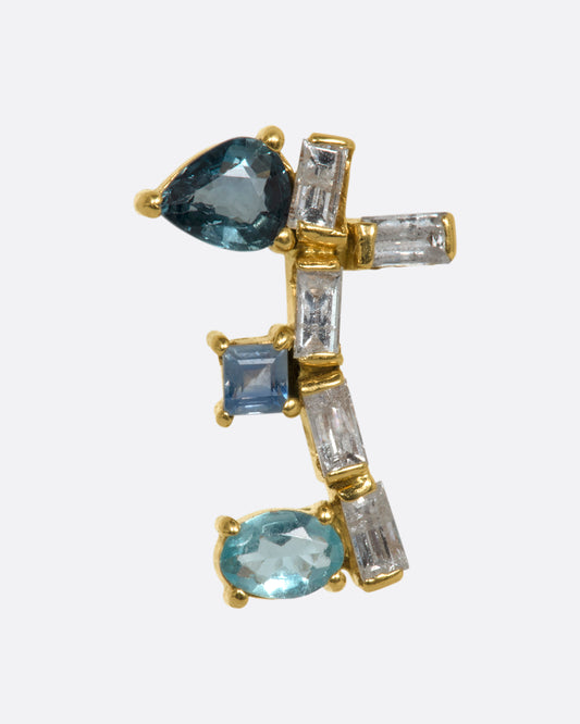 A yellow gold stud earring shaped like a botanical vine made of sapphire, apatite, and diamonds. Shown from the front.