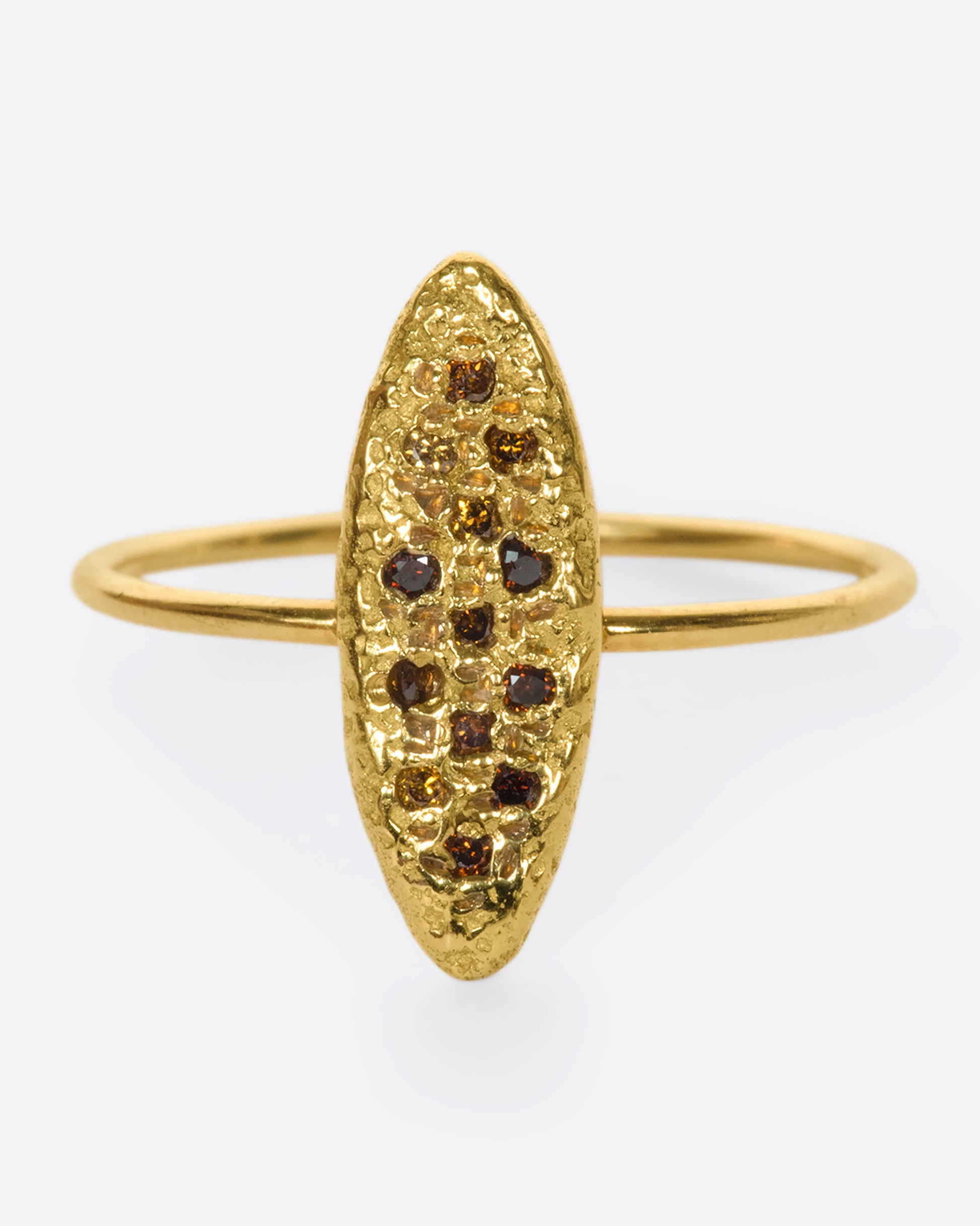 This 18k gold textured oval ring is dotted with vibrant, colorful diamonds
