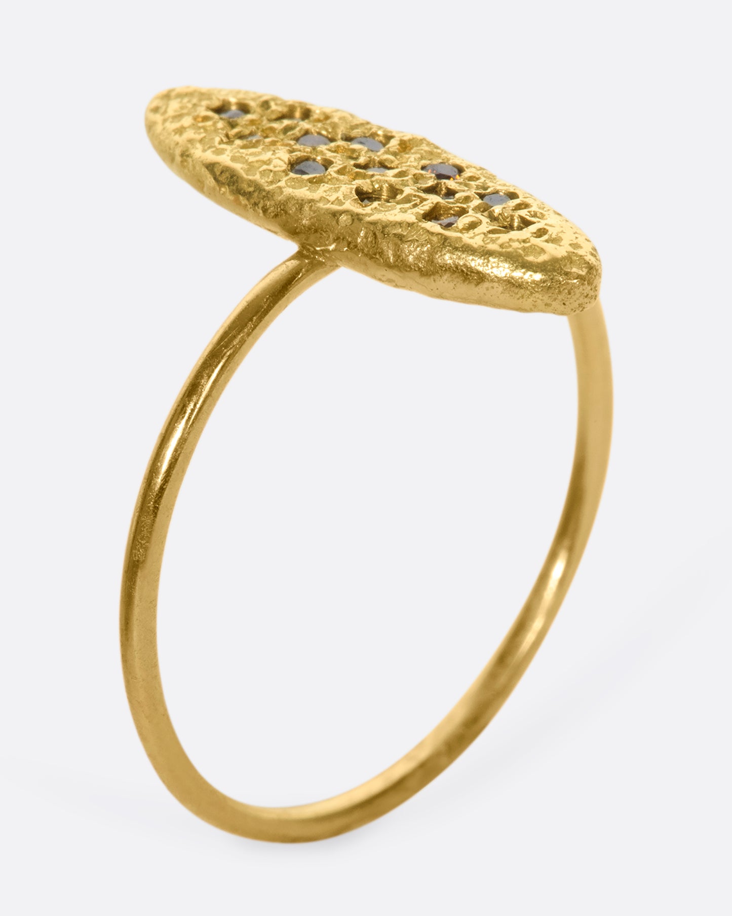 This 18k gold textured oval ring is dotted with vibrant, colorful diamonds