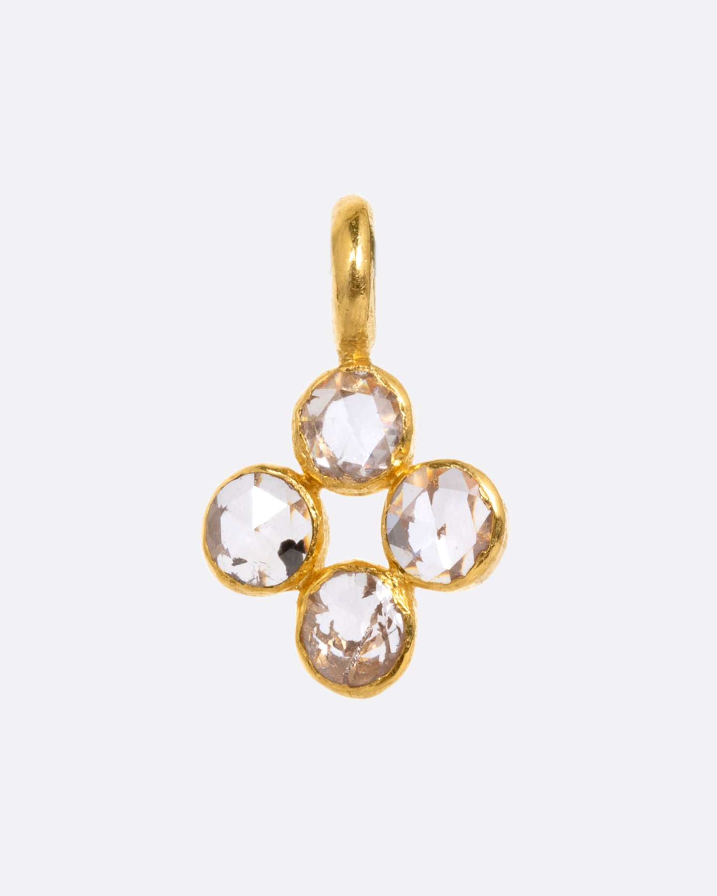 A yellow gold cross shaped charm with four diamonds. Shown from the front.