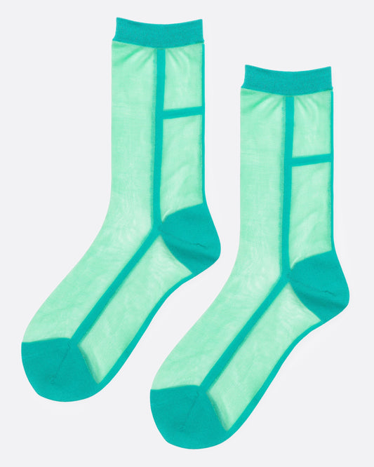 A pair of sheer sea green socks with solid teal trim, cuffs, and toes, shown from the side.