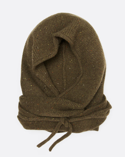 A donegal flecked olive hooded scarf with elongated sides, shown wrapped and tied, from the front.