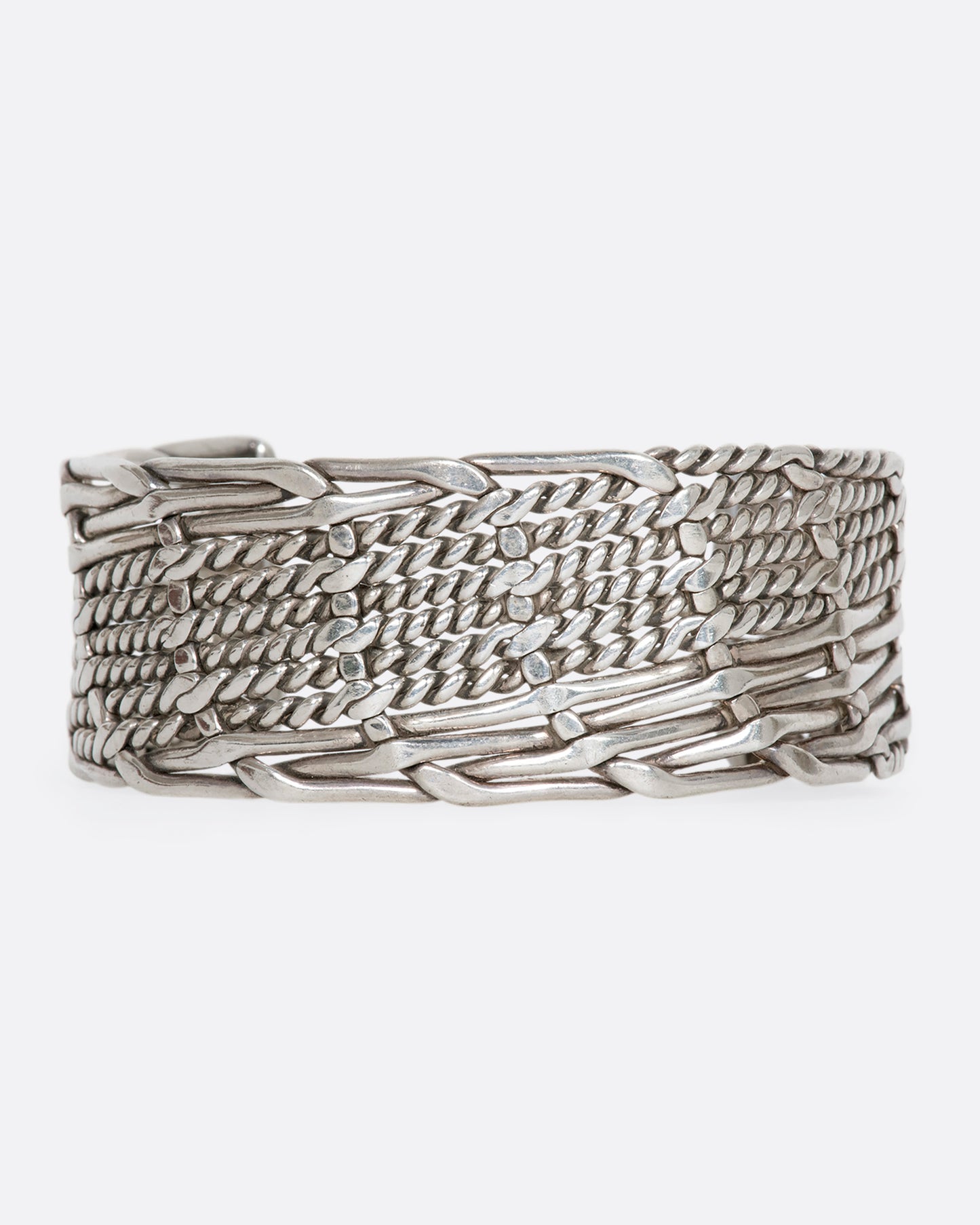 Sterling silver woven and twisted cuff. View from the front.