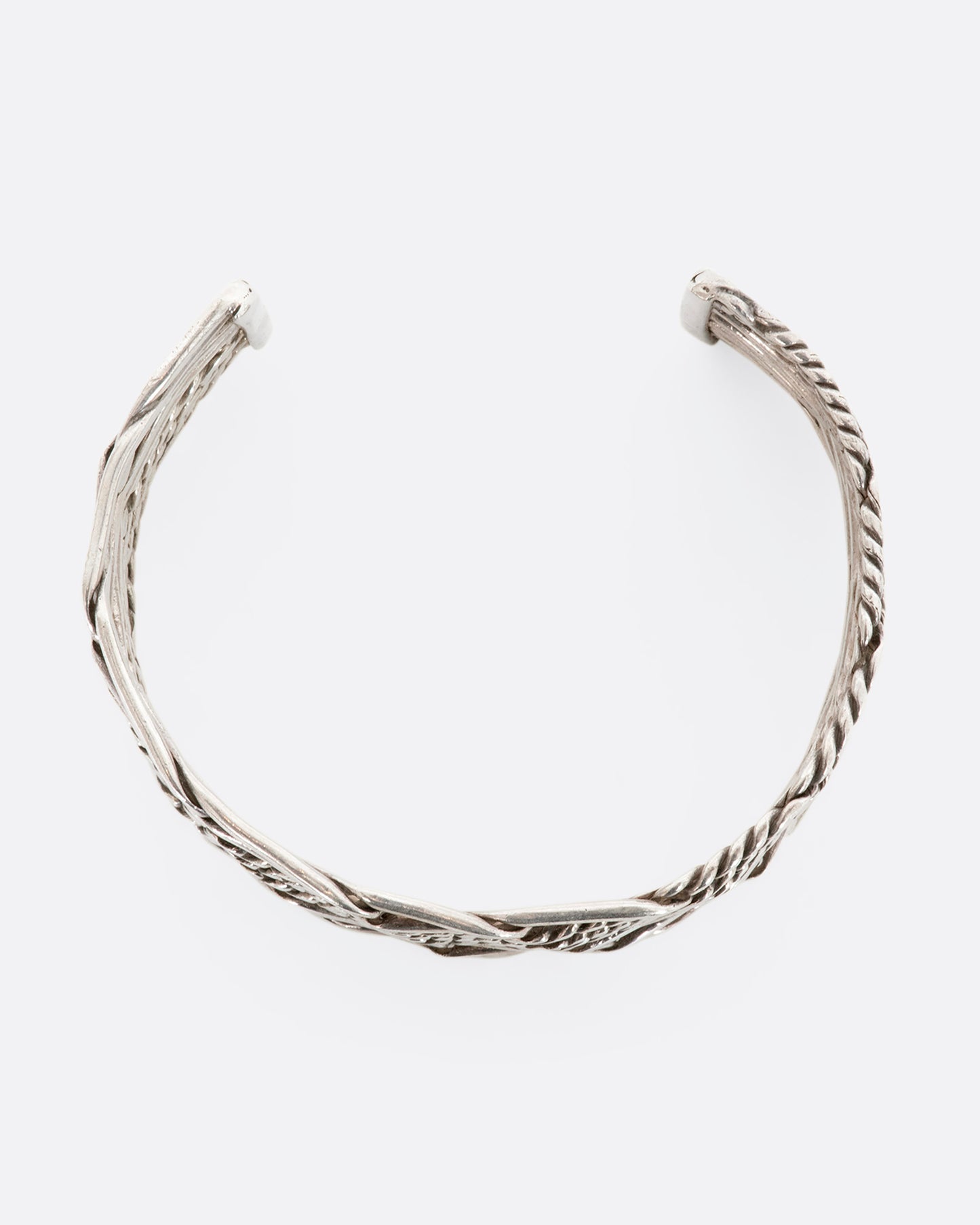 Sterling silver woven and twisted cuff. View from above.