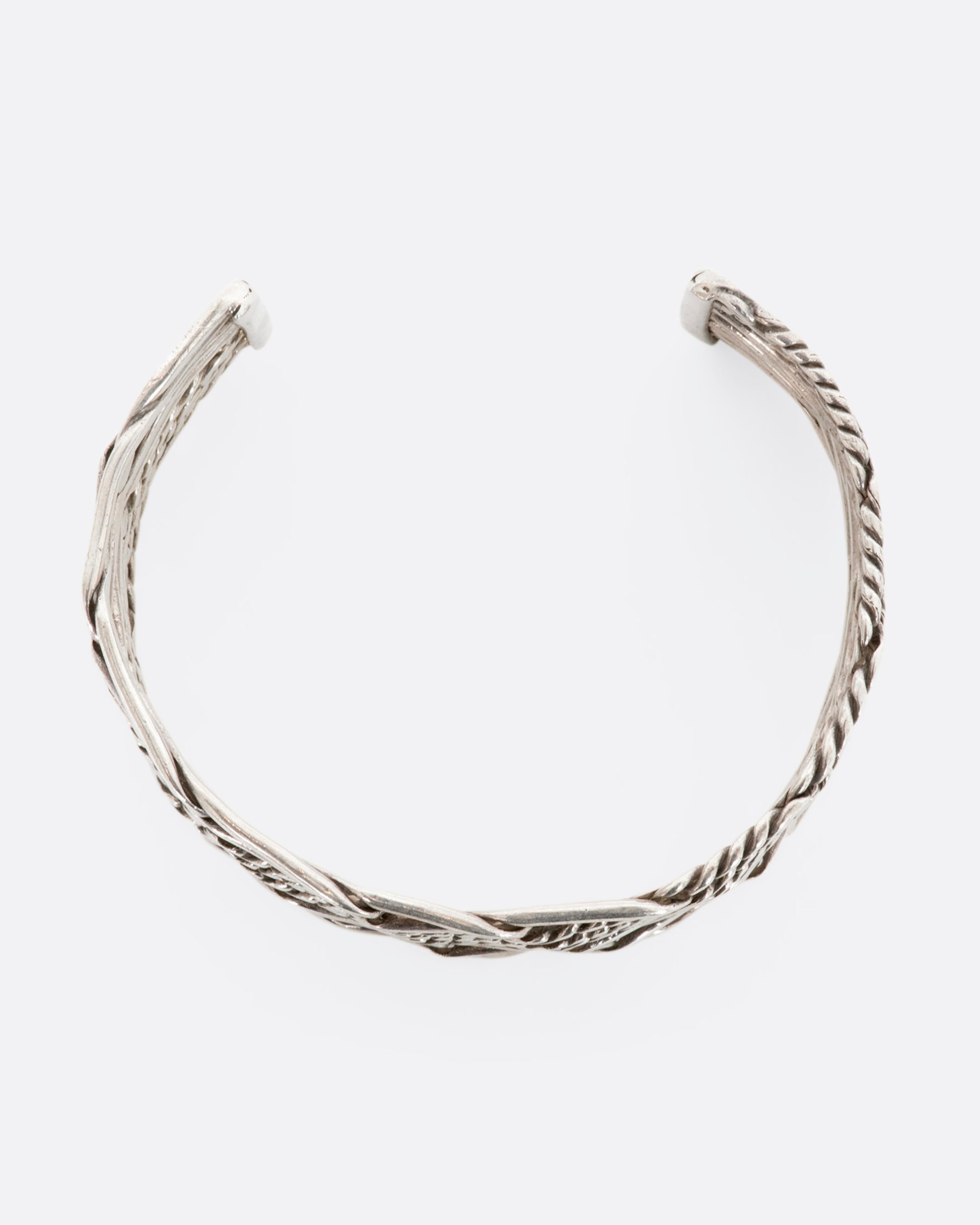 Sterling silver woven and twisted cuff. View from above.