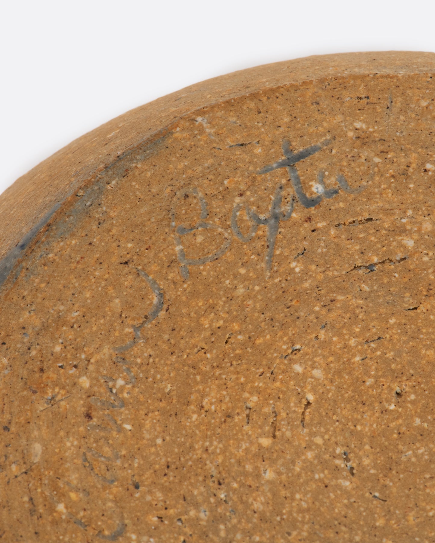 Blue ceramic batter bowl with an aloe plant. View of the signature.