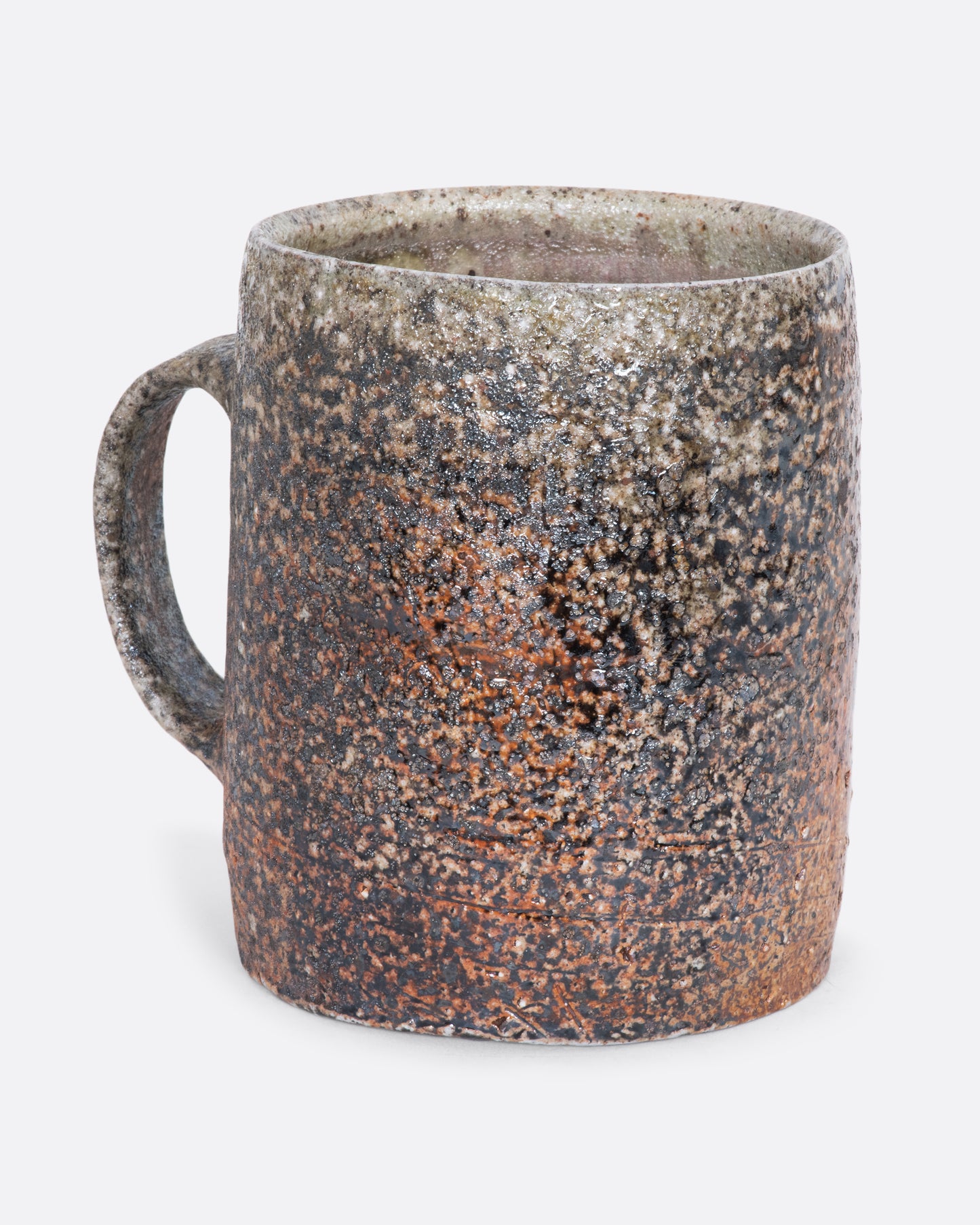 A hand thrown brown ceramic mug. View from the alternate side.