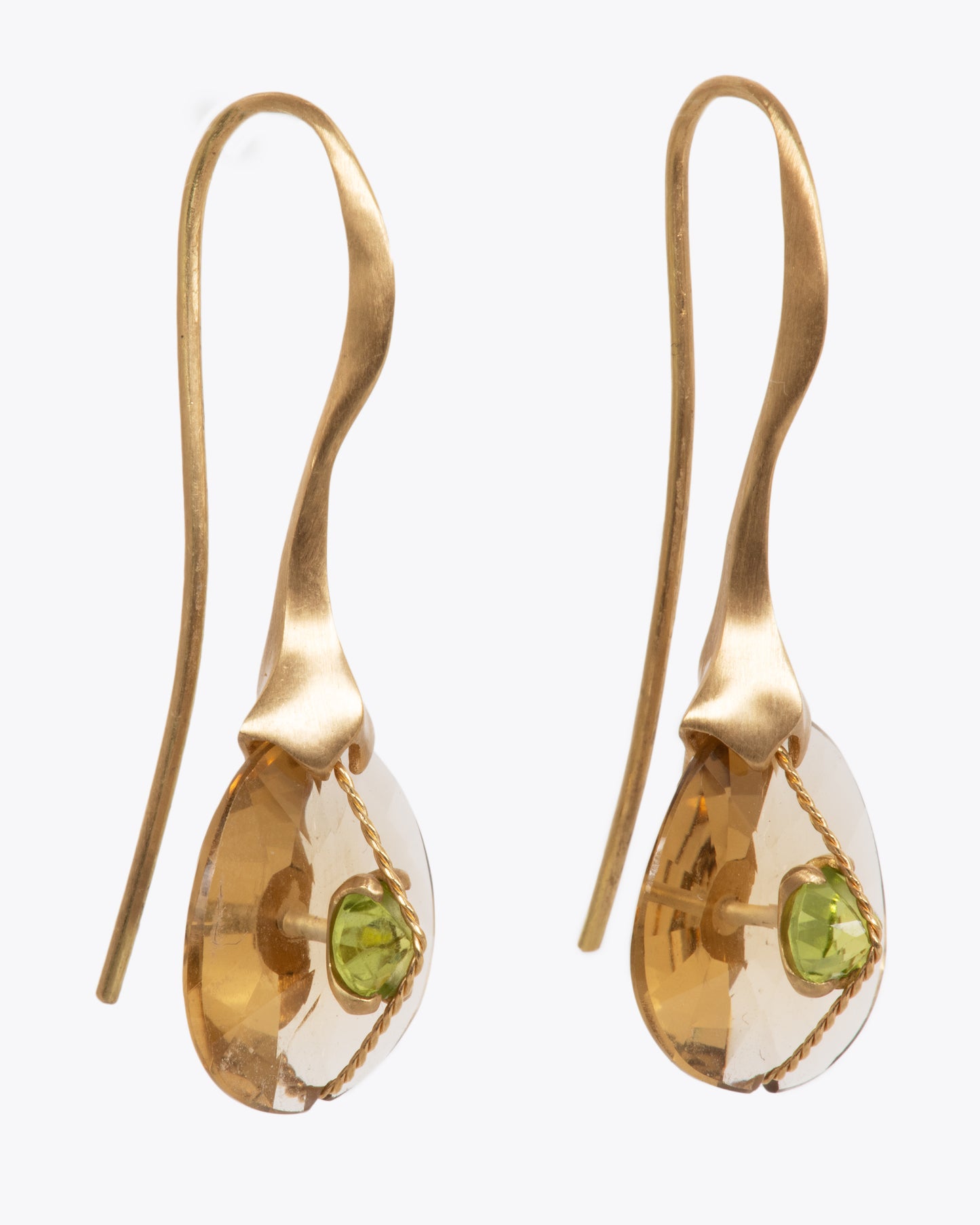 Two yellow gold hook dangle earrings with quartz and peridot. View from the front.