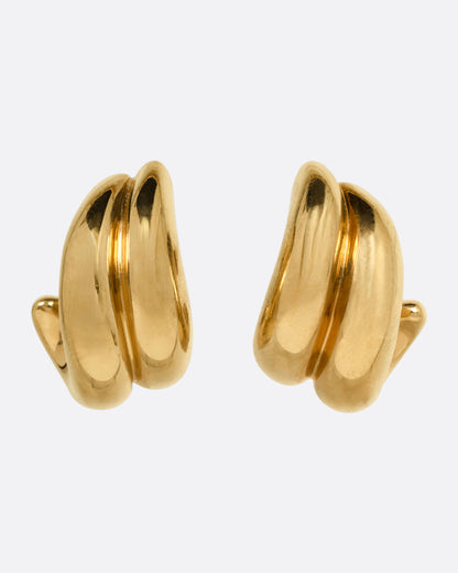 Vintage domed huggie earrings in yellow gold, two curved polished ridges wrapping the earlobe