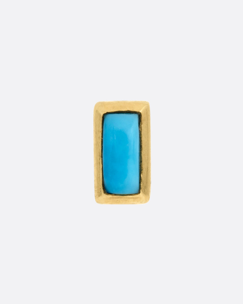 A yellow gold stud earring with a baguette cut turquoise, shown from the front.