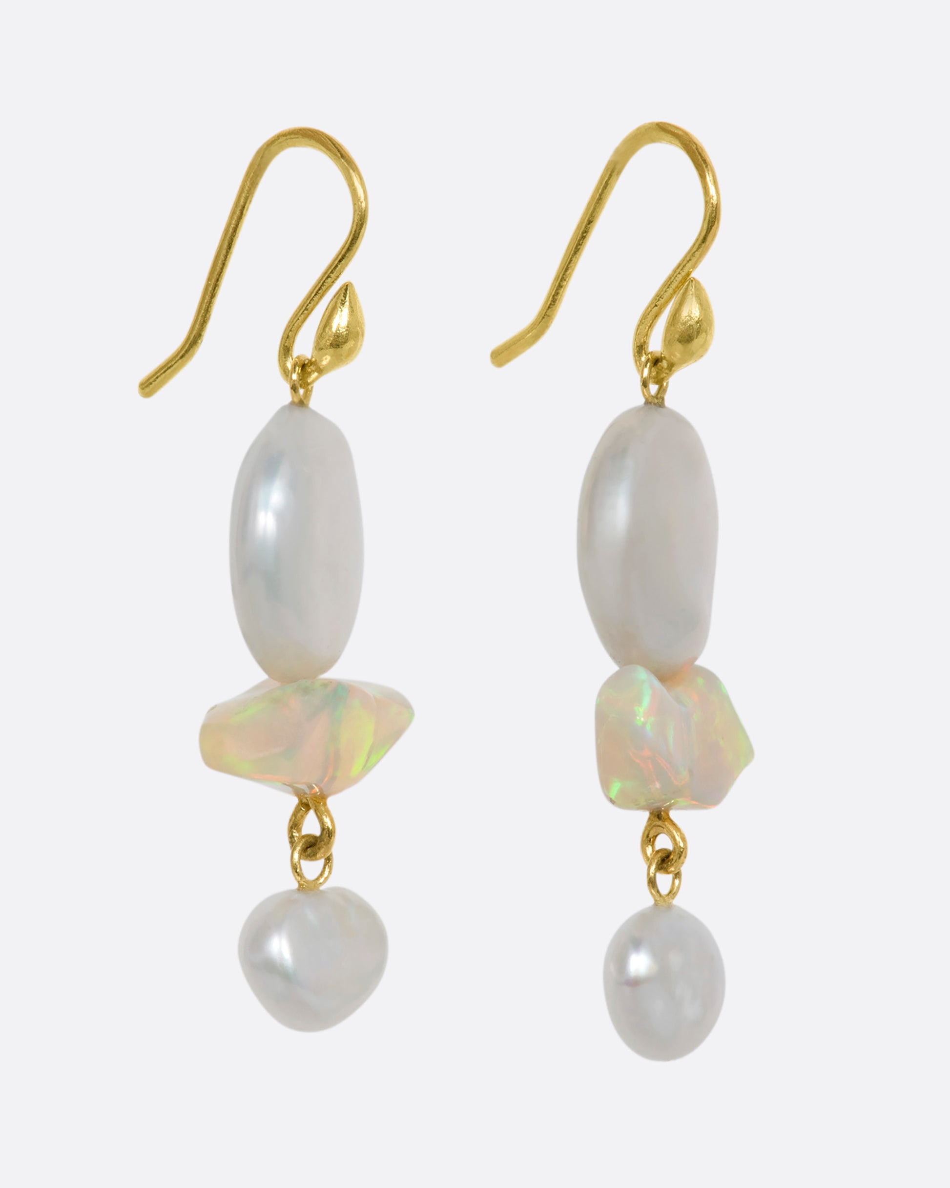 Yellow gold triple tier drop earrings with pearls and opals. View from the side.