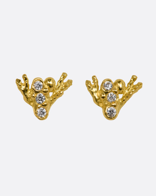 A pair of yellow gold studs abstractly shaped like a bee with diamonds. Shown from the front.