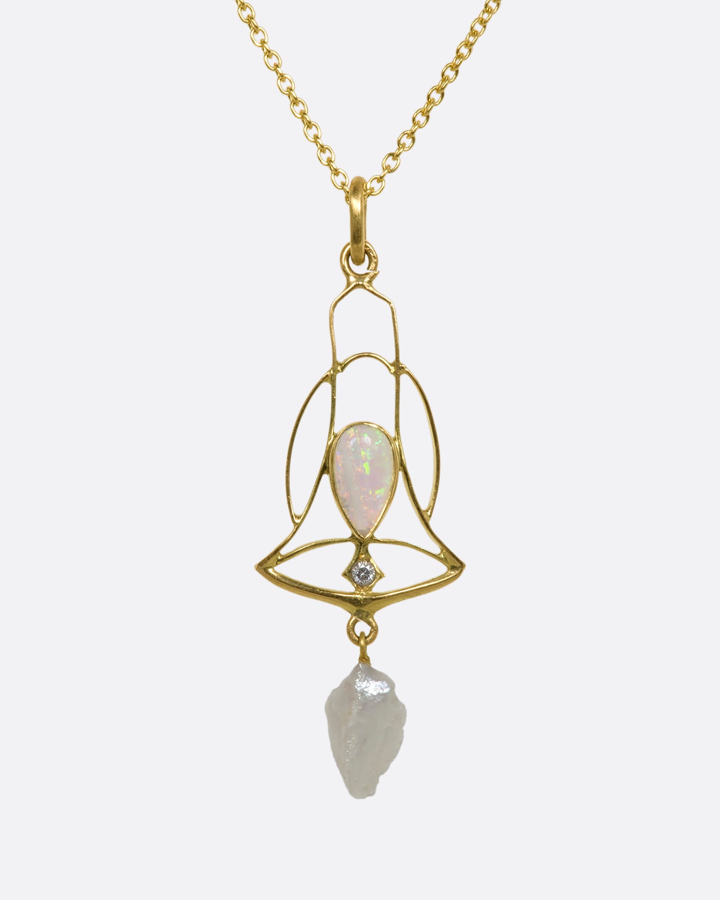 A yellow gold openwork bell pendant with an opal, diamond and dangling pearl. View from the front.