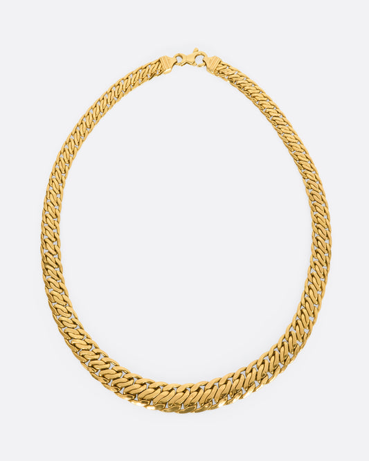 A yellow gold flat double curb chain necklace. View from above from the front.