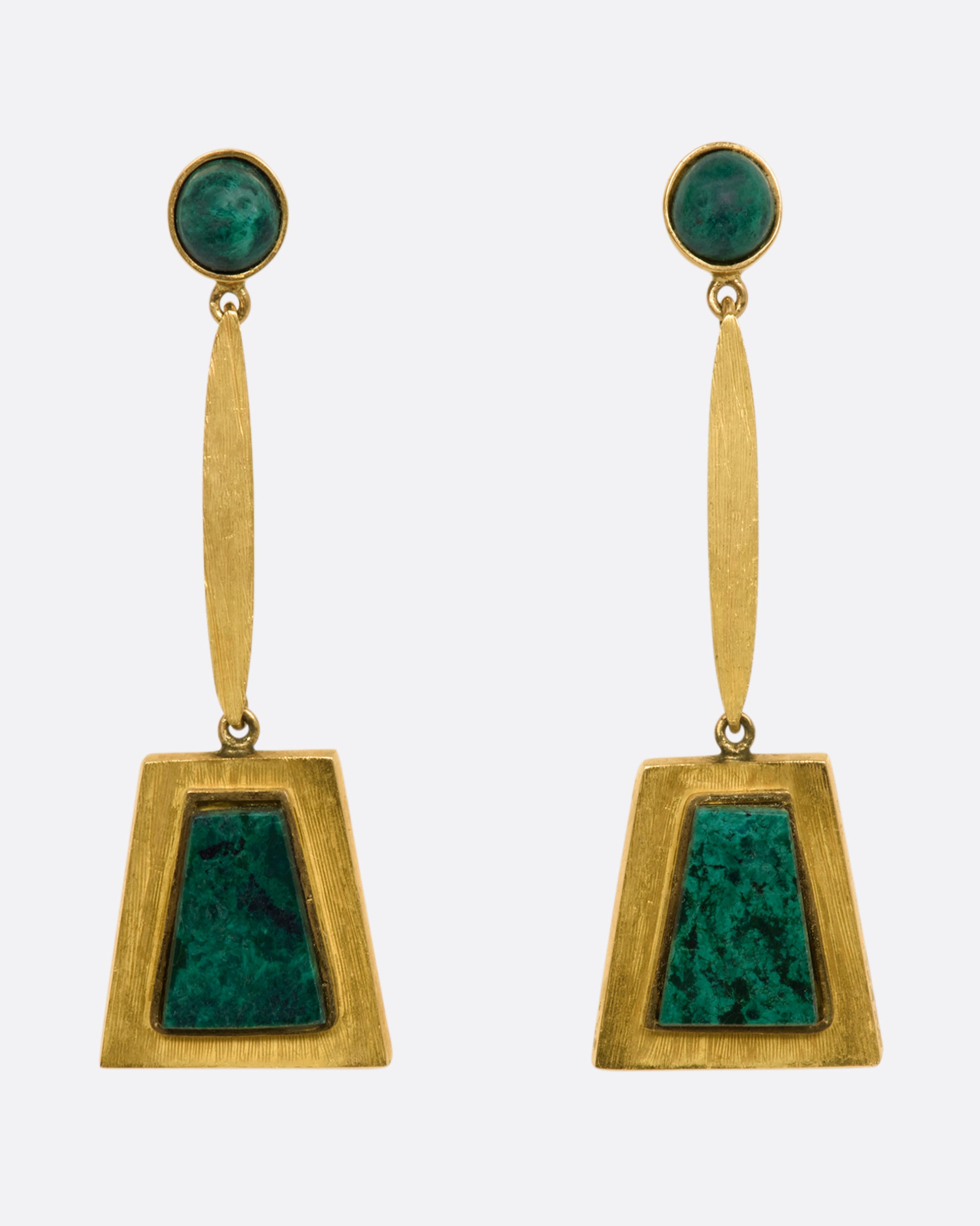 A yellow gold pair of trapezoid drop earrings with malachite. View from the front.