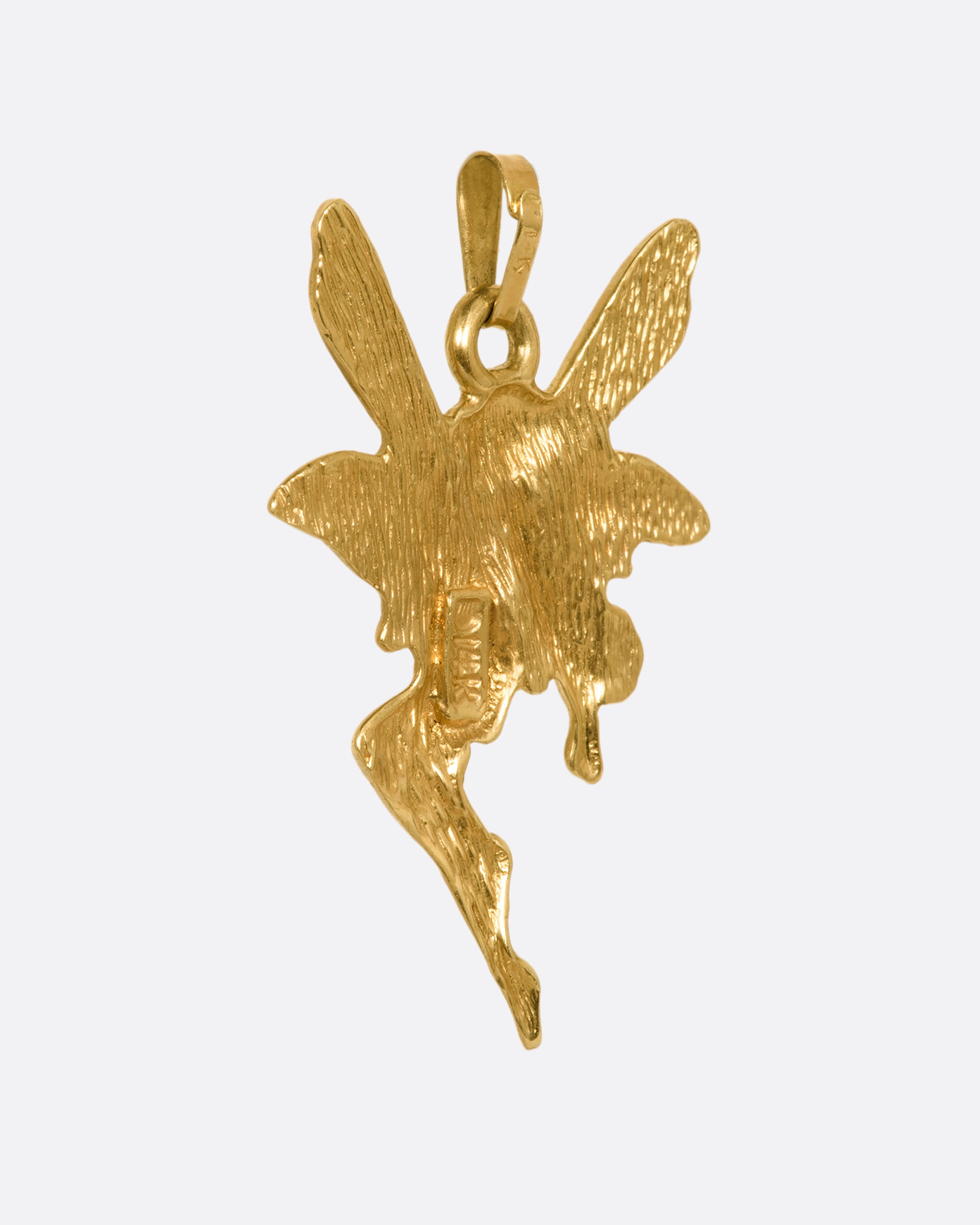 A yellow gold faerie pendant. View from the back.