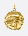 A yellow gold Capricorn medal with a goat. View from the front.