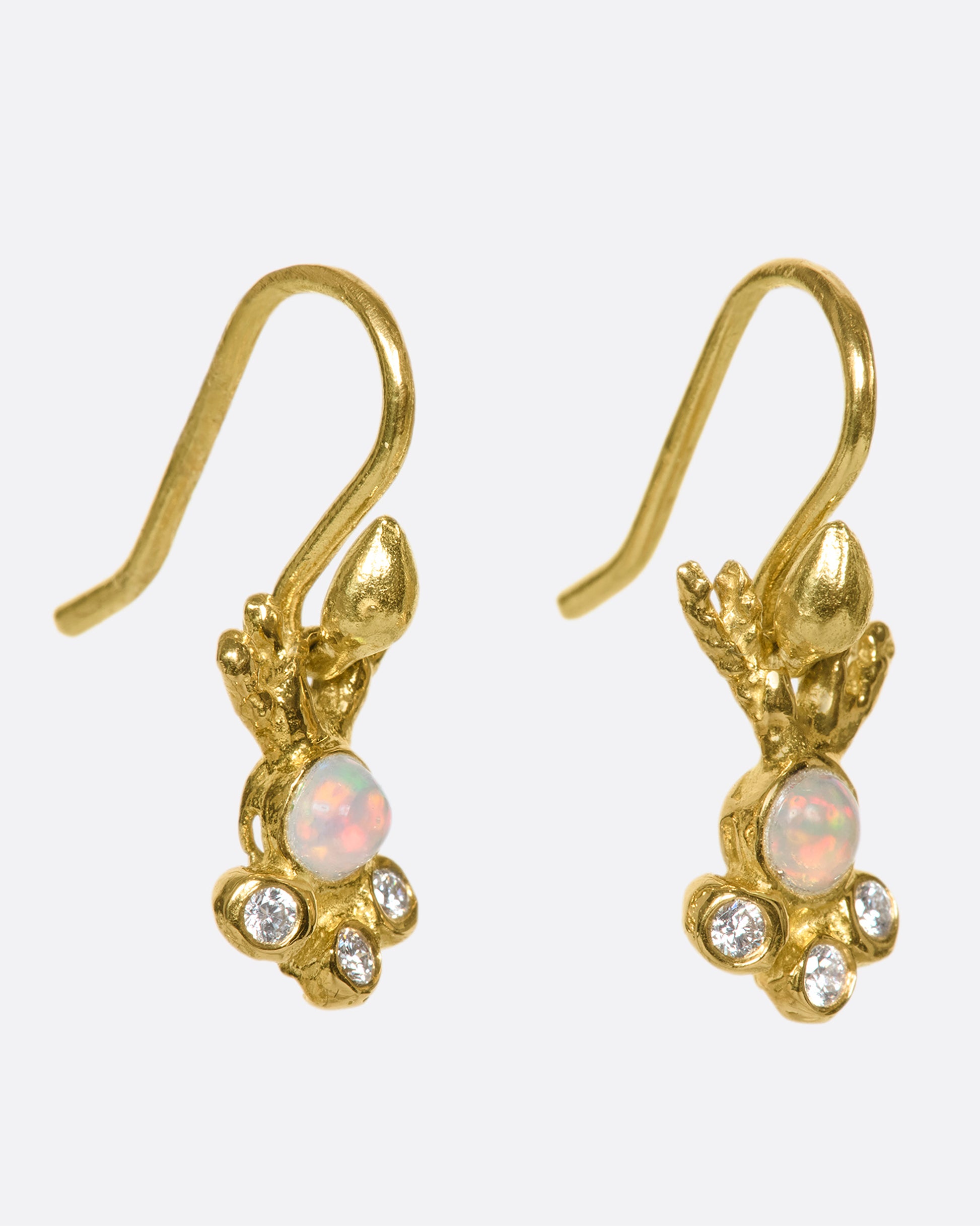 These 18k gold drops with opals and diamond details look like coral glimmering in sunlit water as they swing under your ear.