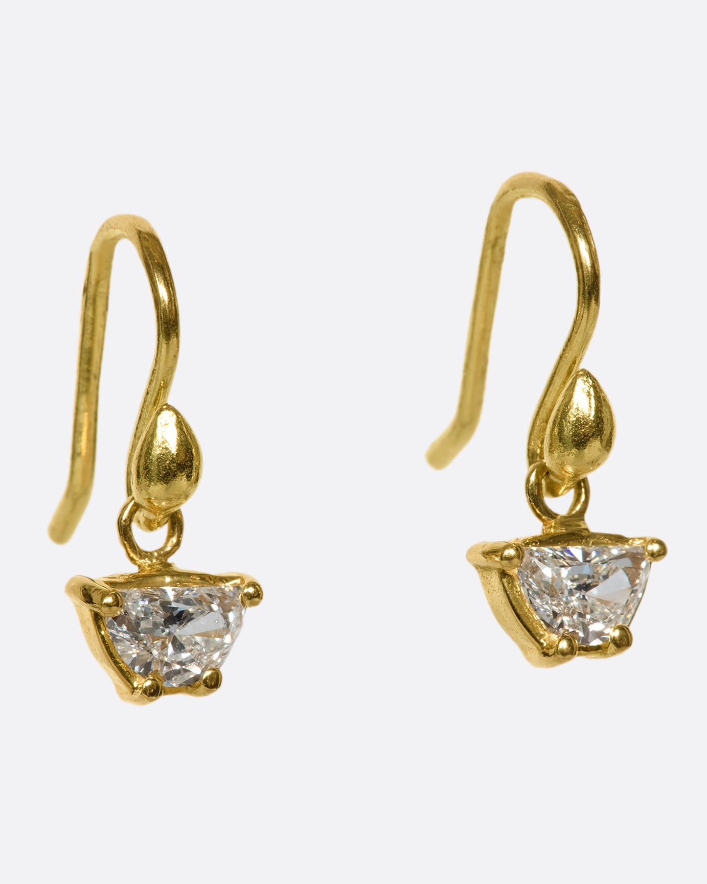A unique pair of trapezoid-shaped diamond drops set in 18k gold