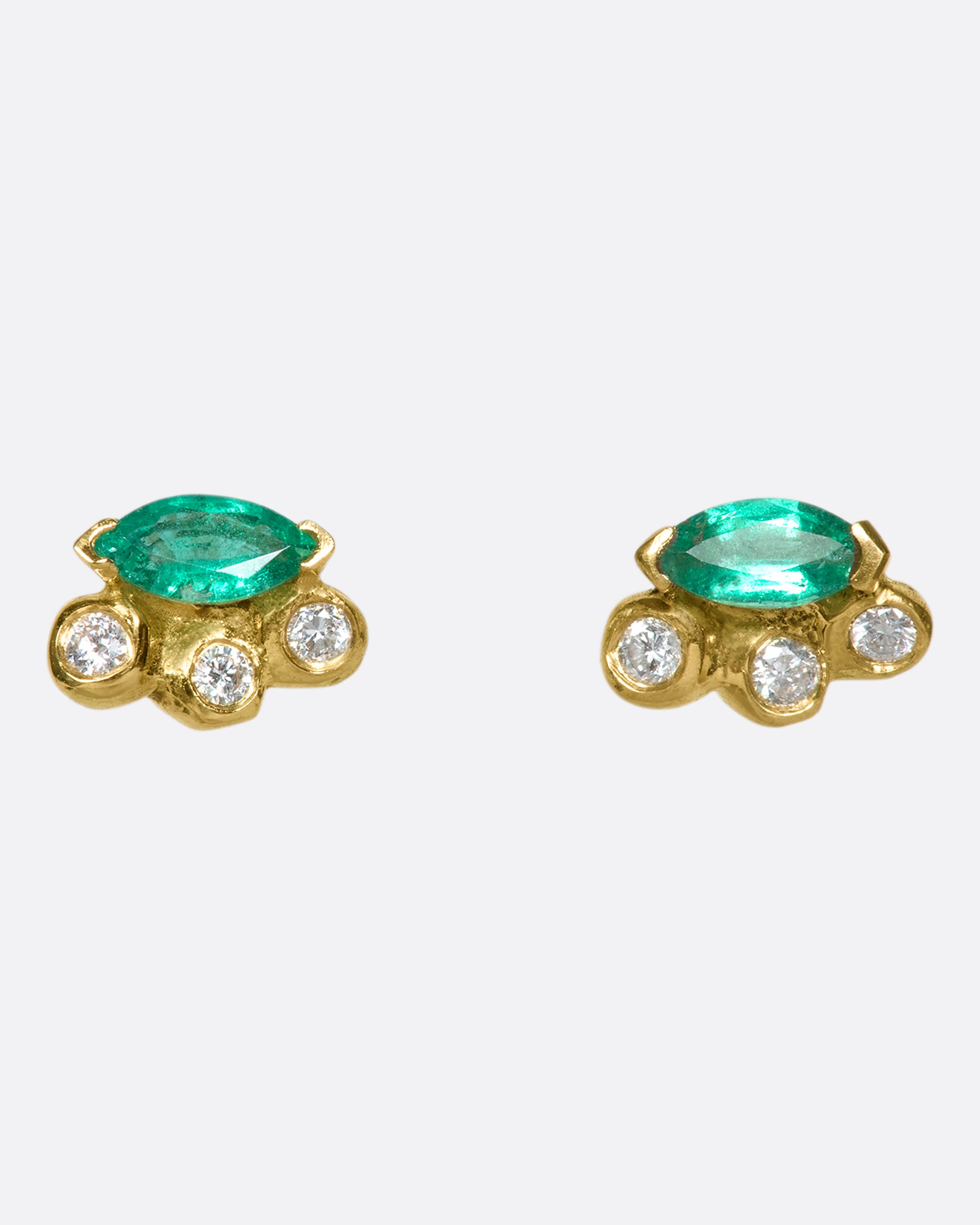 Marquise emerald and diamond studs wrapped in 18k gold