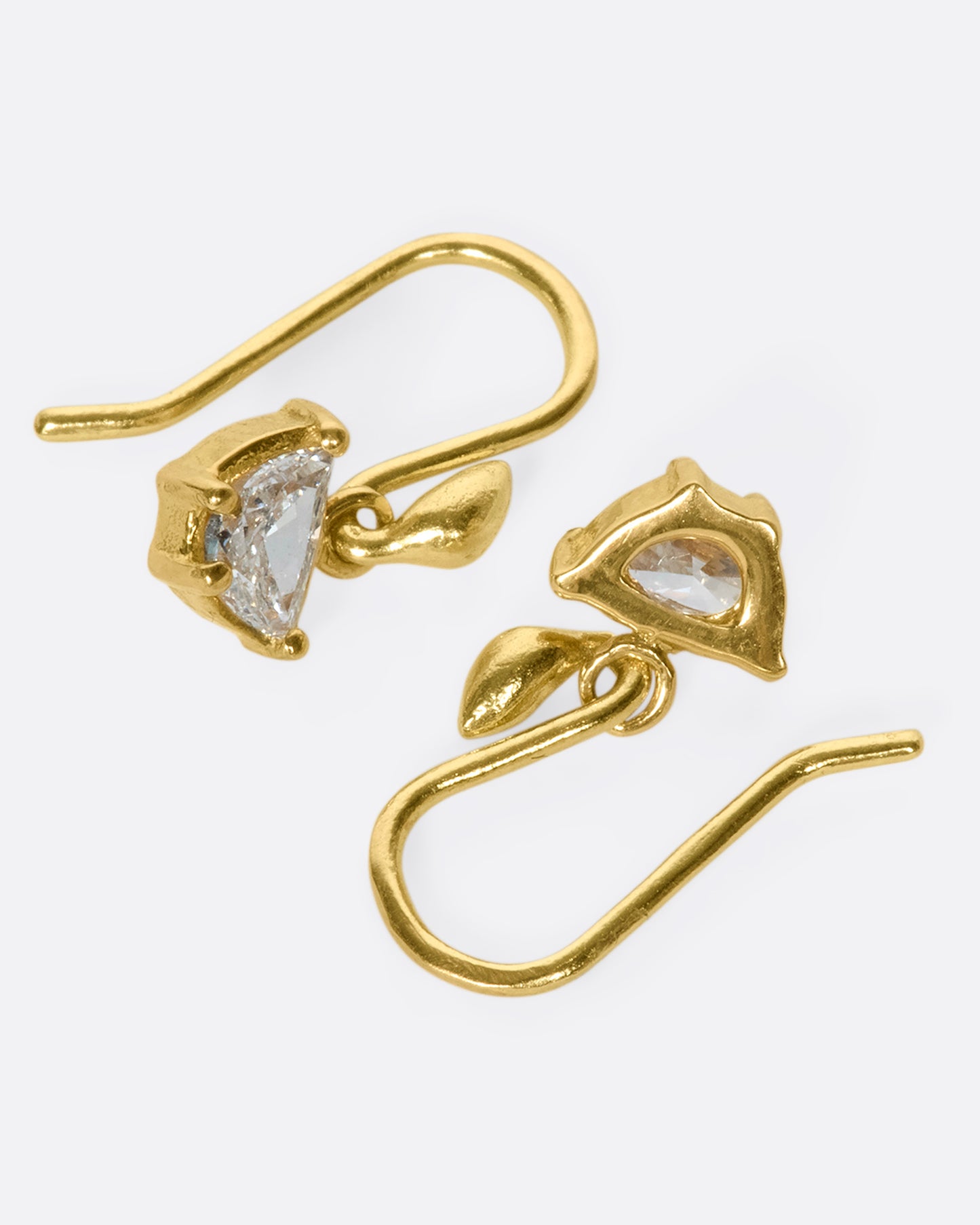 A unique pair of trapezoid-shaped diamond drops set in 18k gold