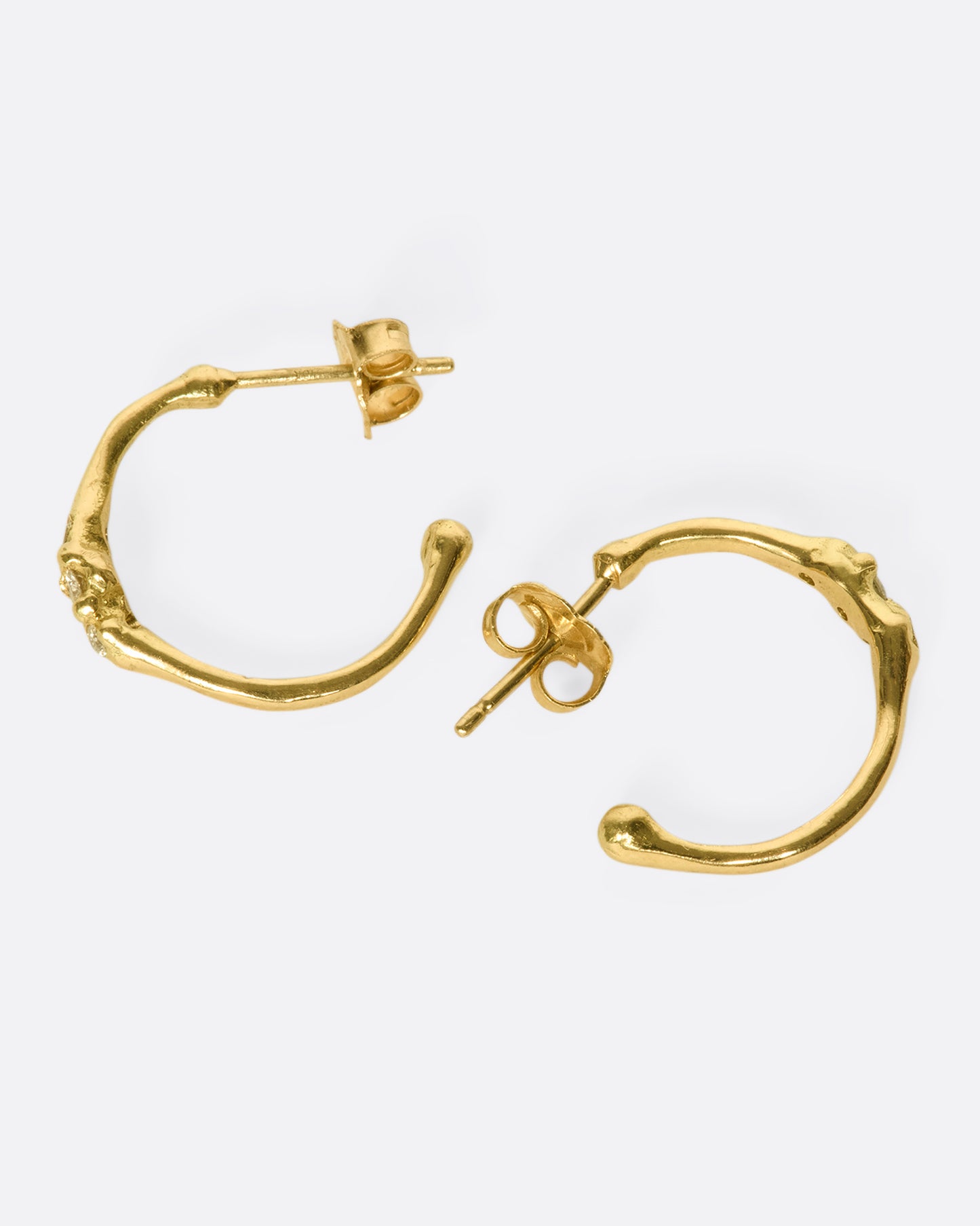 18k gold stud hoops with three diamonds set across the front