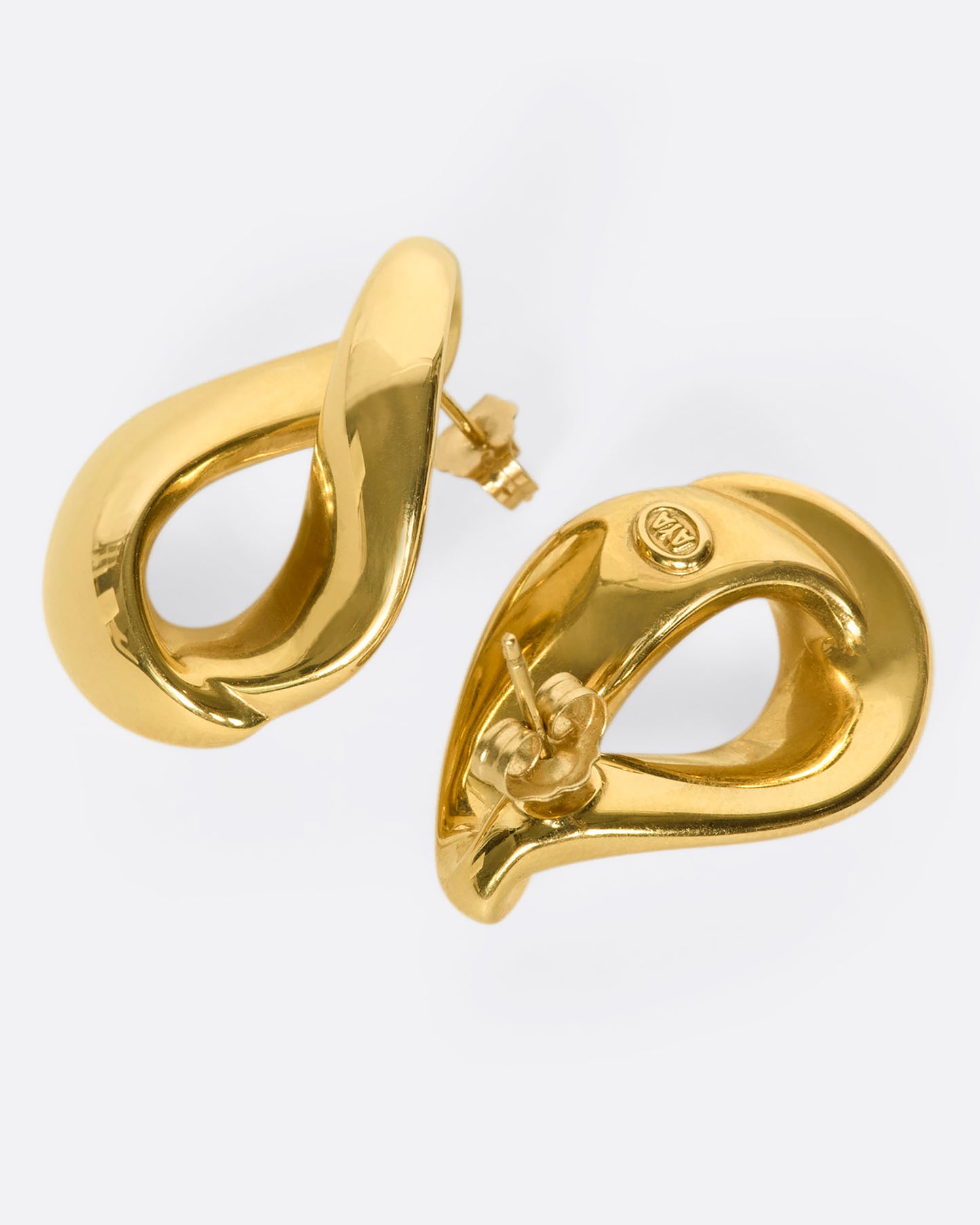 An elegant pair of 18k gold folded-hoop estate stud earrings. These are hollow and lightweight