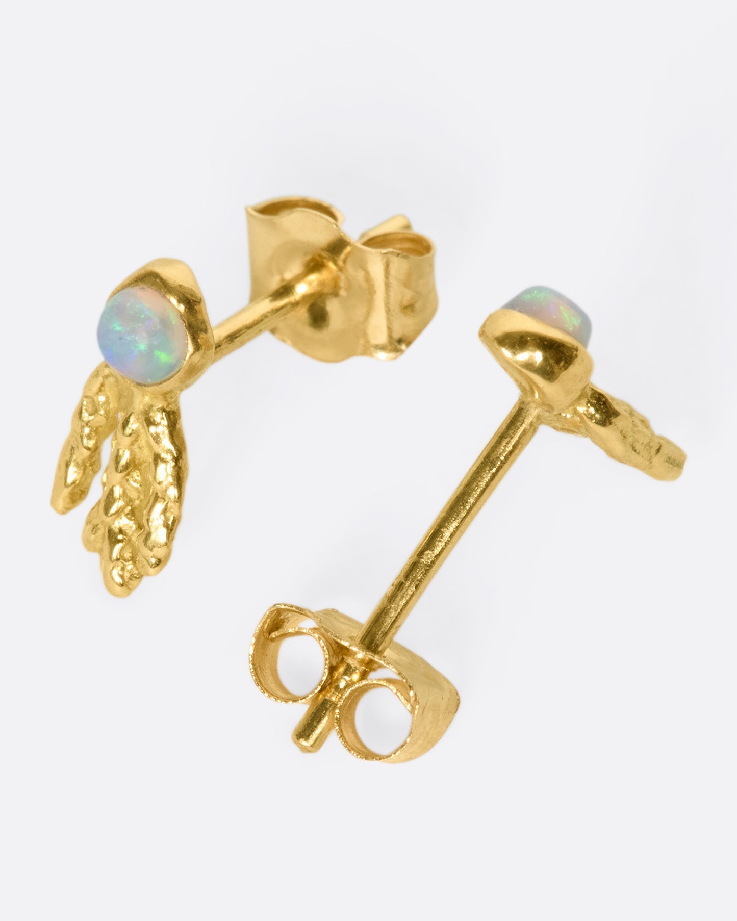 18k gold and opal small drop earrings that look like a glowing sea creatures swimming across your ear