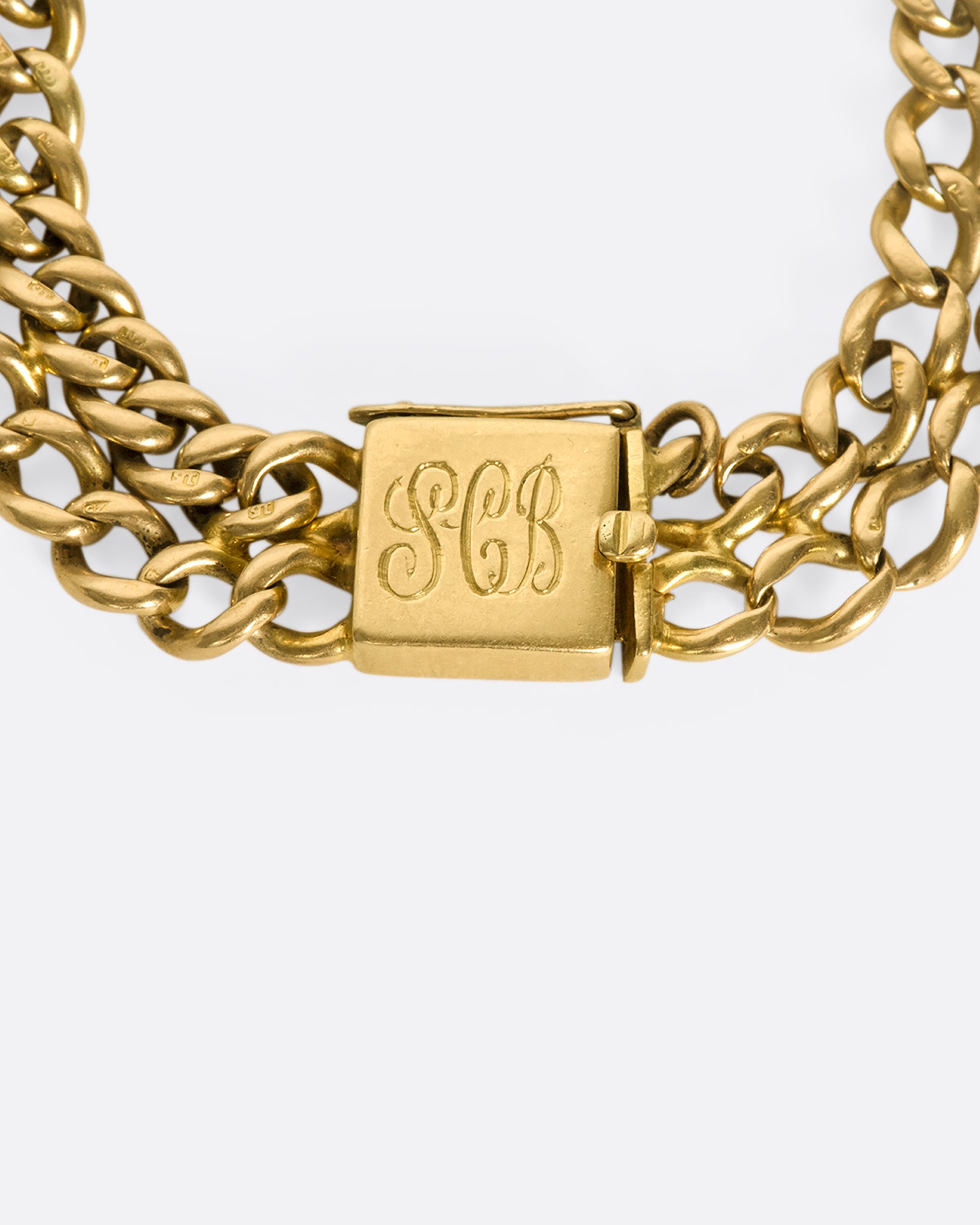 A 15k gold 1950s double-chain bracelet with substantial square clasp, engraved SCB.