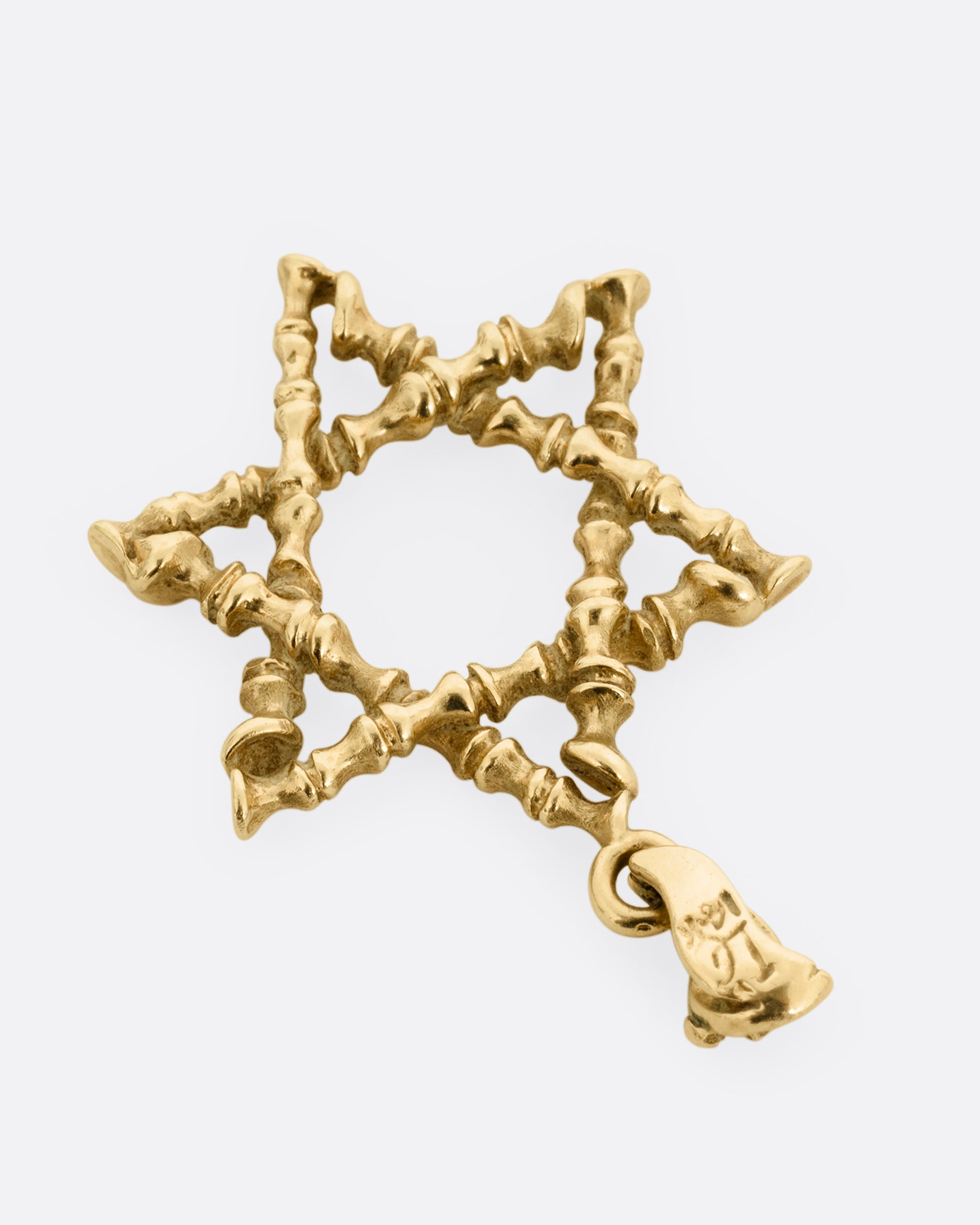 A yellow gold  Star of David pendant with textural lines, shown from the back.