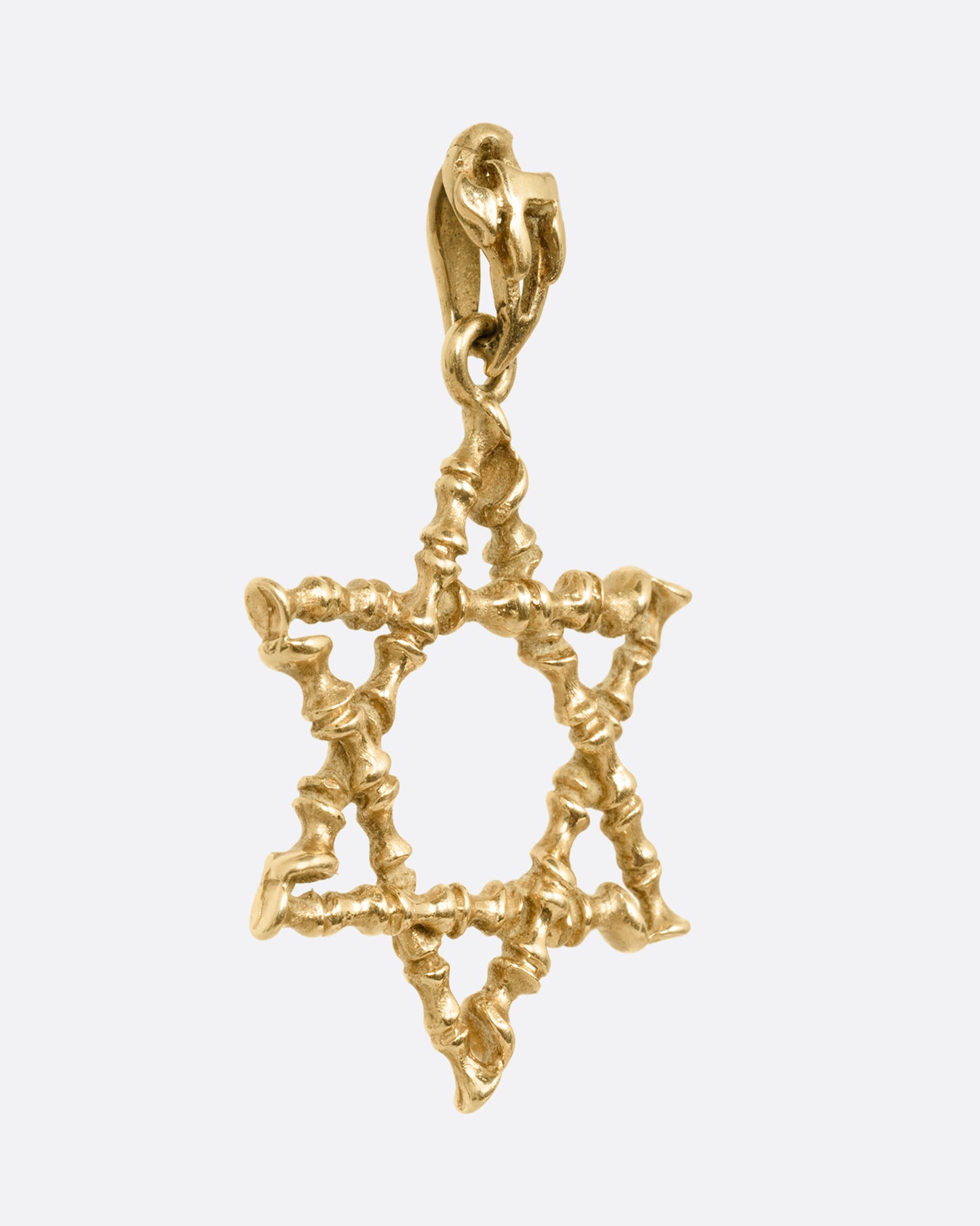 A yellow gold  Star of David pendant with textural lines, shown from the side.